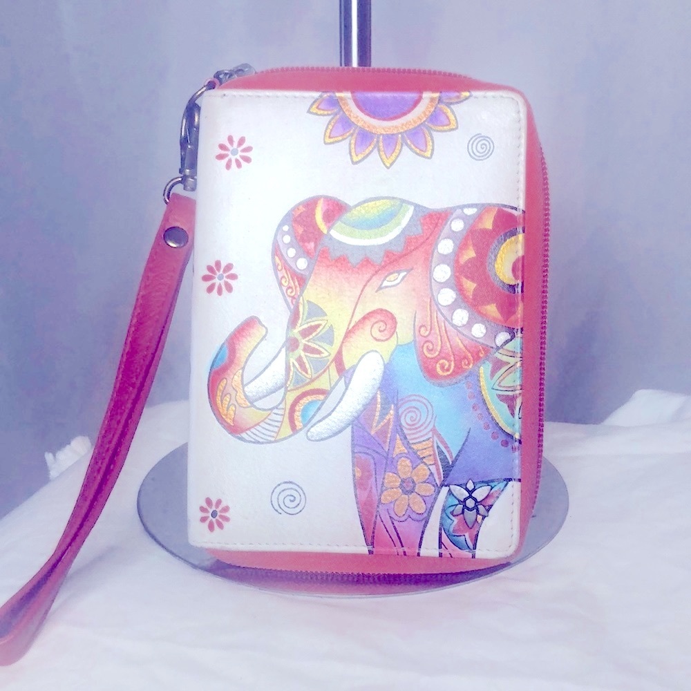ANUSHKA genuine leather Wristlet with colorful elephant on front.